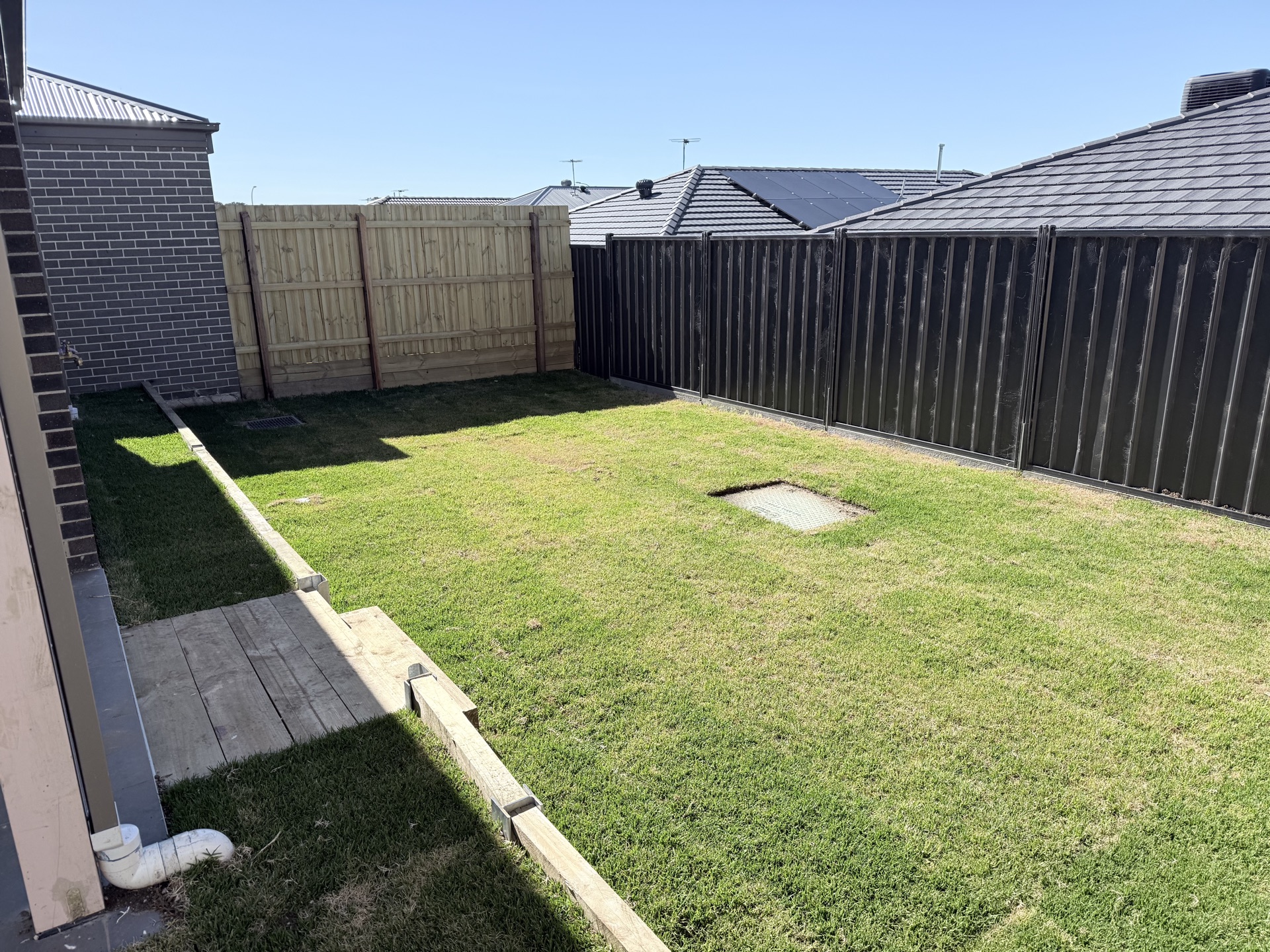 Colorbond and timber fencing in a backyard